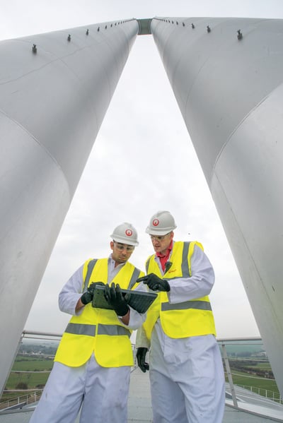 Veolia engineers at a wastewater treatment plant using a digital platform Veolia engineers at a wastewater treatment plant using a digital platform